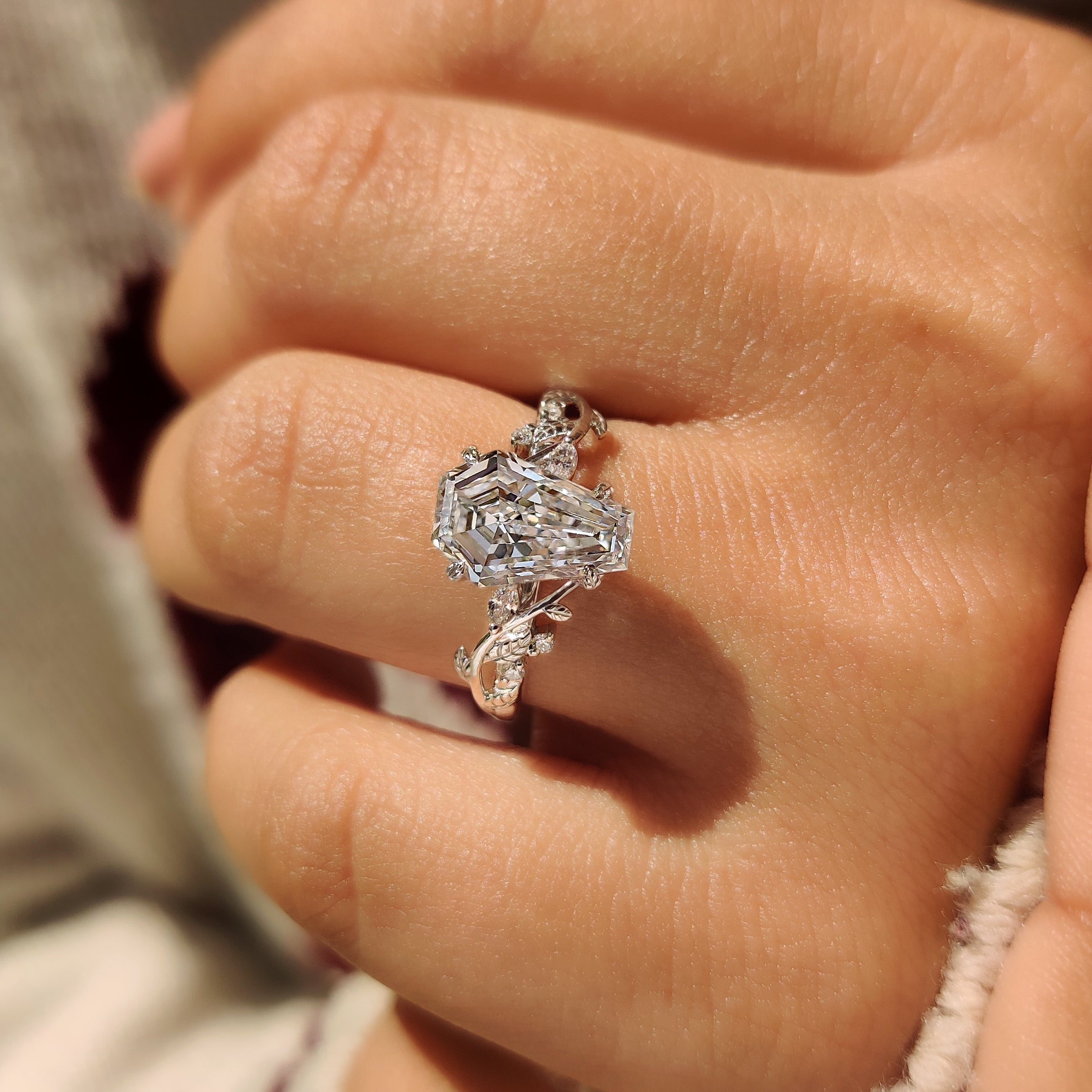 Lab grown coffin diamond ring with nature inspired design.
