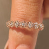 Nature inspired wedding band with round diamond flower design.
