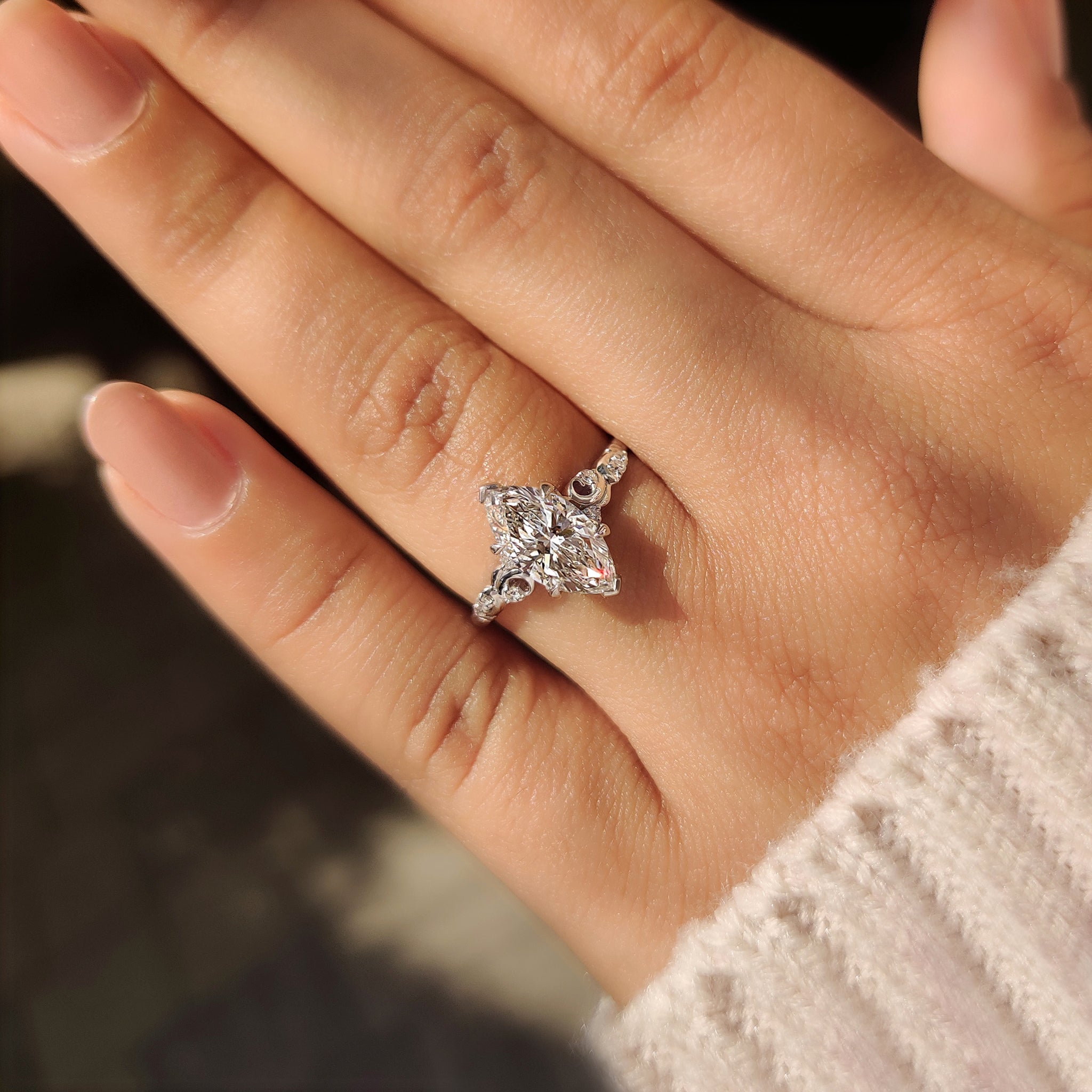 Vintage marquise diamond ring with four claw prong setting
