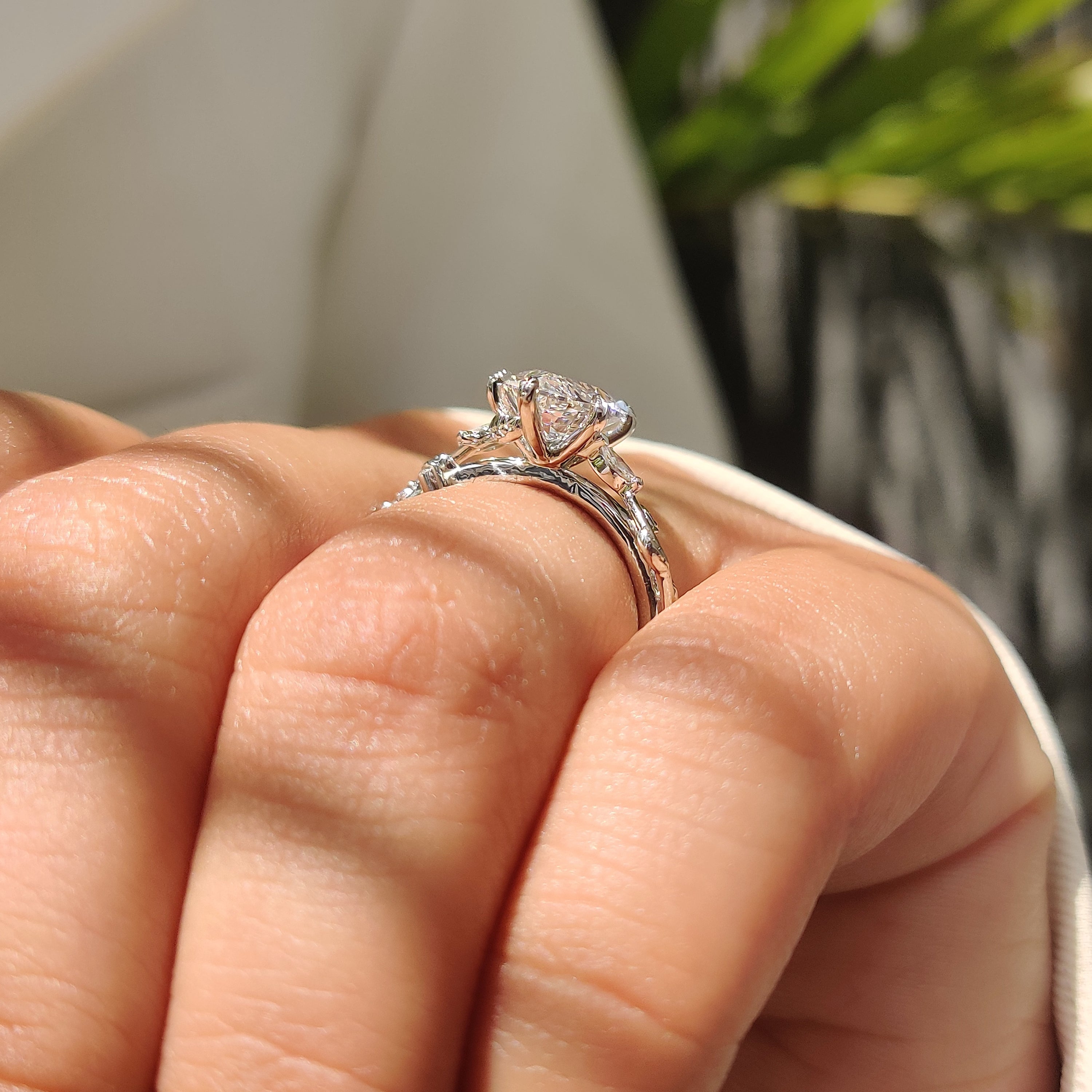 Dutch marquise diamond ring with round accent stones.
