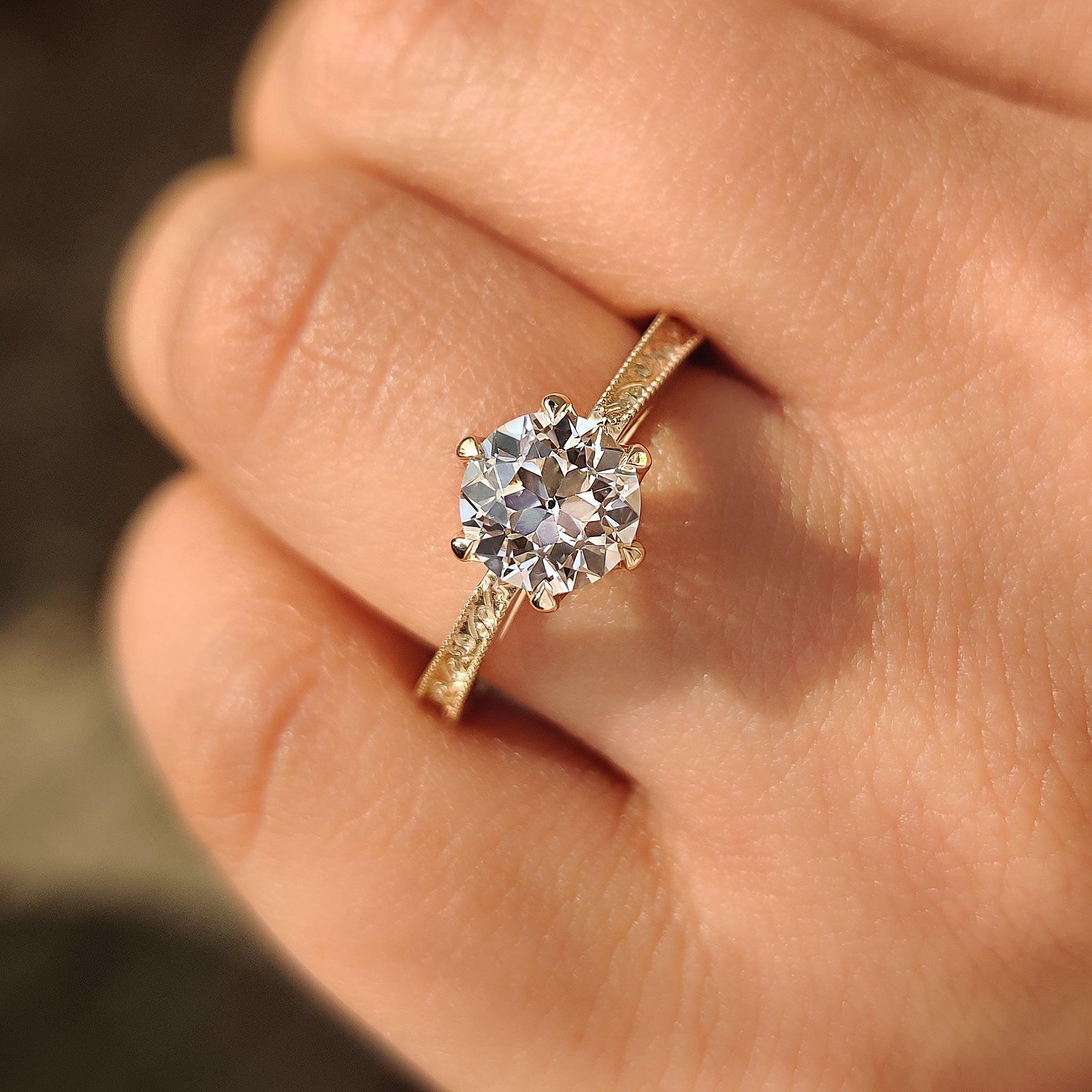 Vintage style round diamond ring with tulip setting basket
