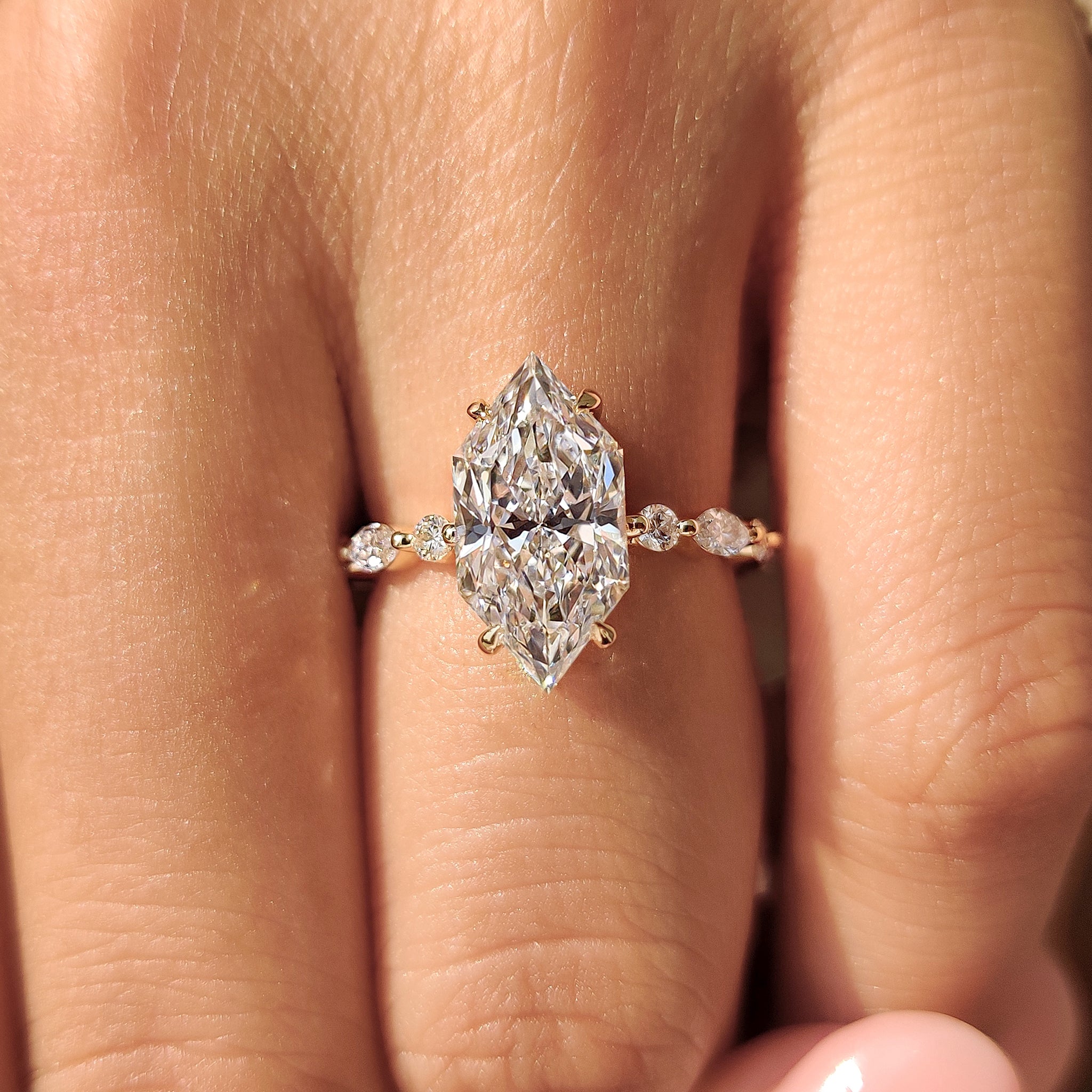 Dutch marquise diamond ring with marquise and round pave.
