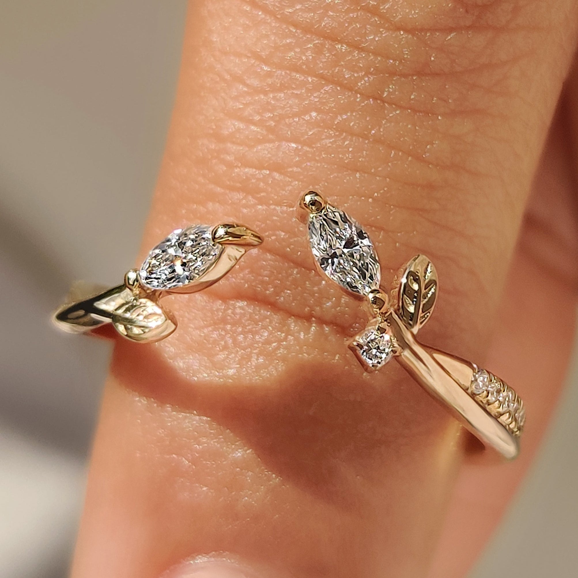 Stackable wedding bands with marquise and round lab diamonds.
