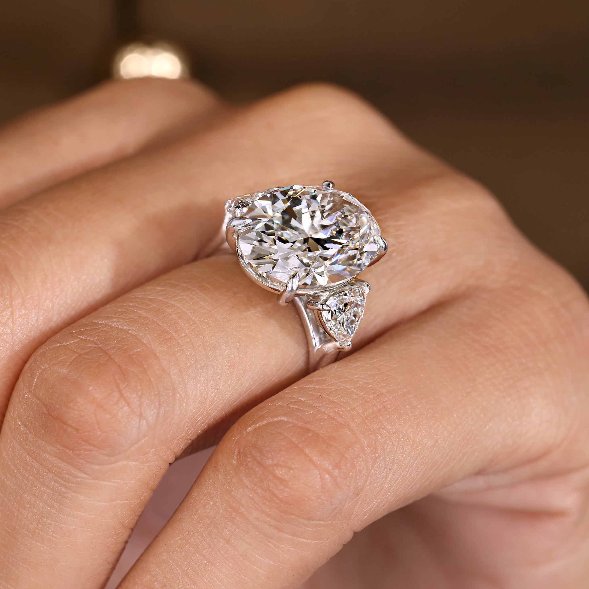 IGI Certified 10 -15 Carat Oval Diamond Ring in Three Stone Style