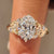 Cherry blossom ring with oval cut center diamond.
