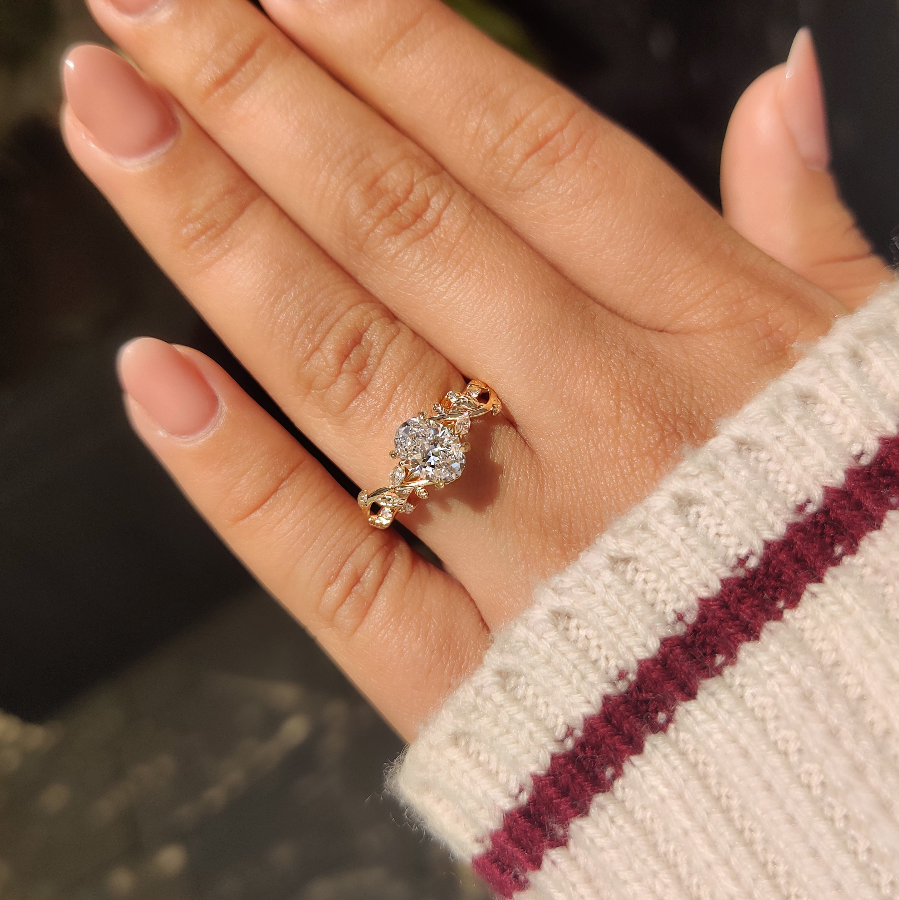 Nature inspired oval ring with round and marquise stones.
