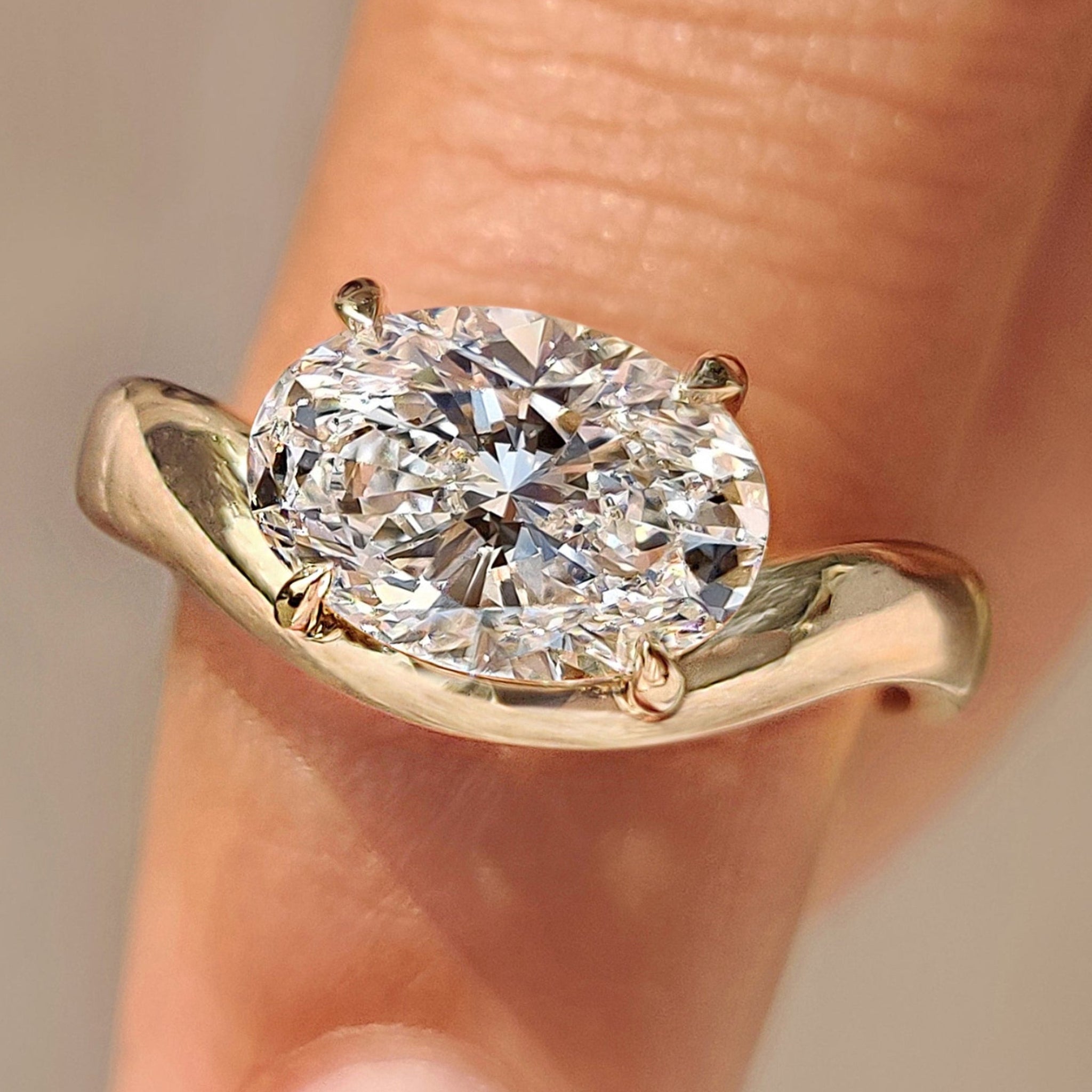 Oval cut diamond ring in east to west setting