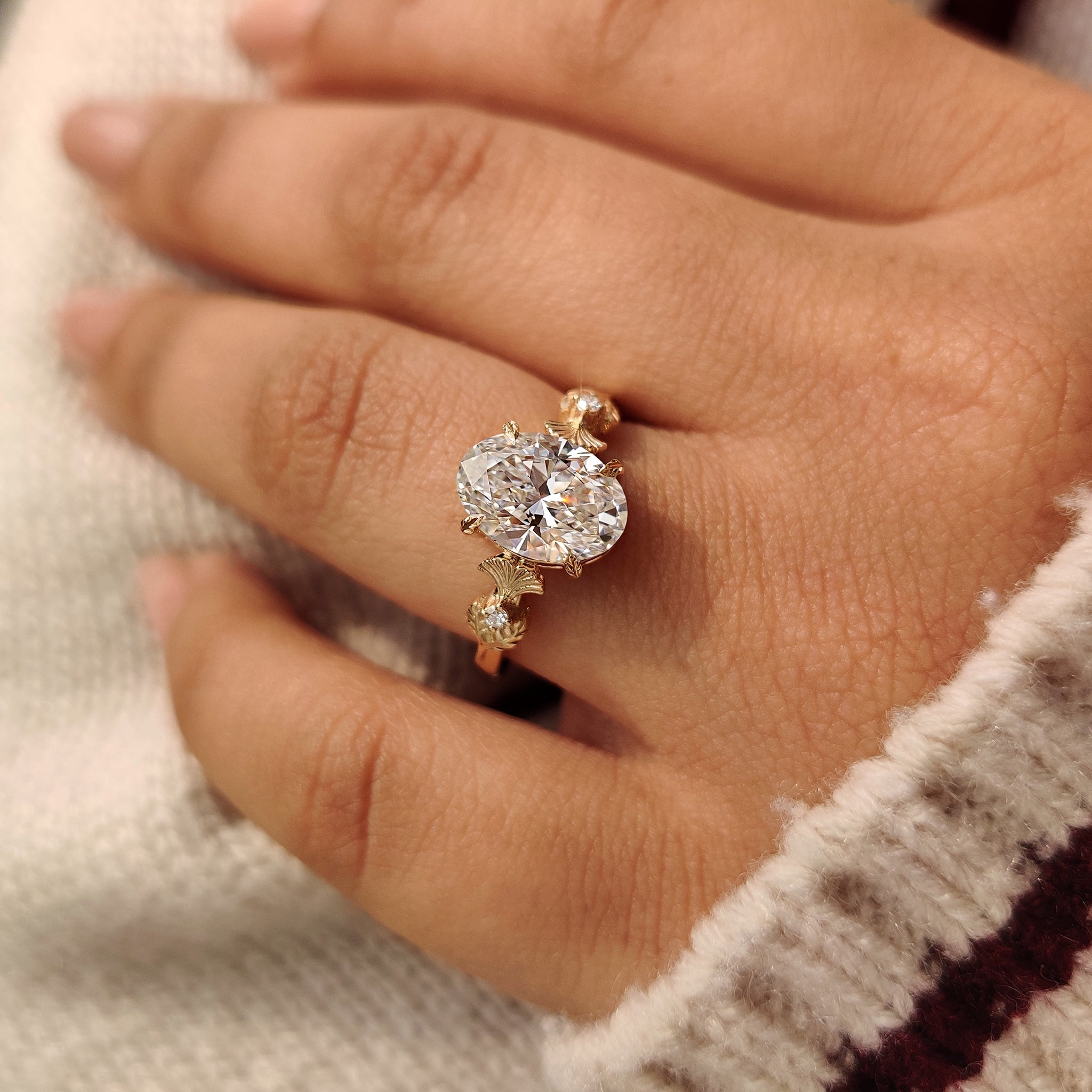 Oval diamond ring with leaf style prong setting
