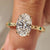 Art Deco diamond ring with oval cut center diamond.
