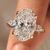 Three stone engagement ring with oval and pear diamonds
