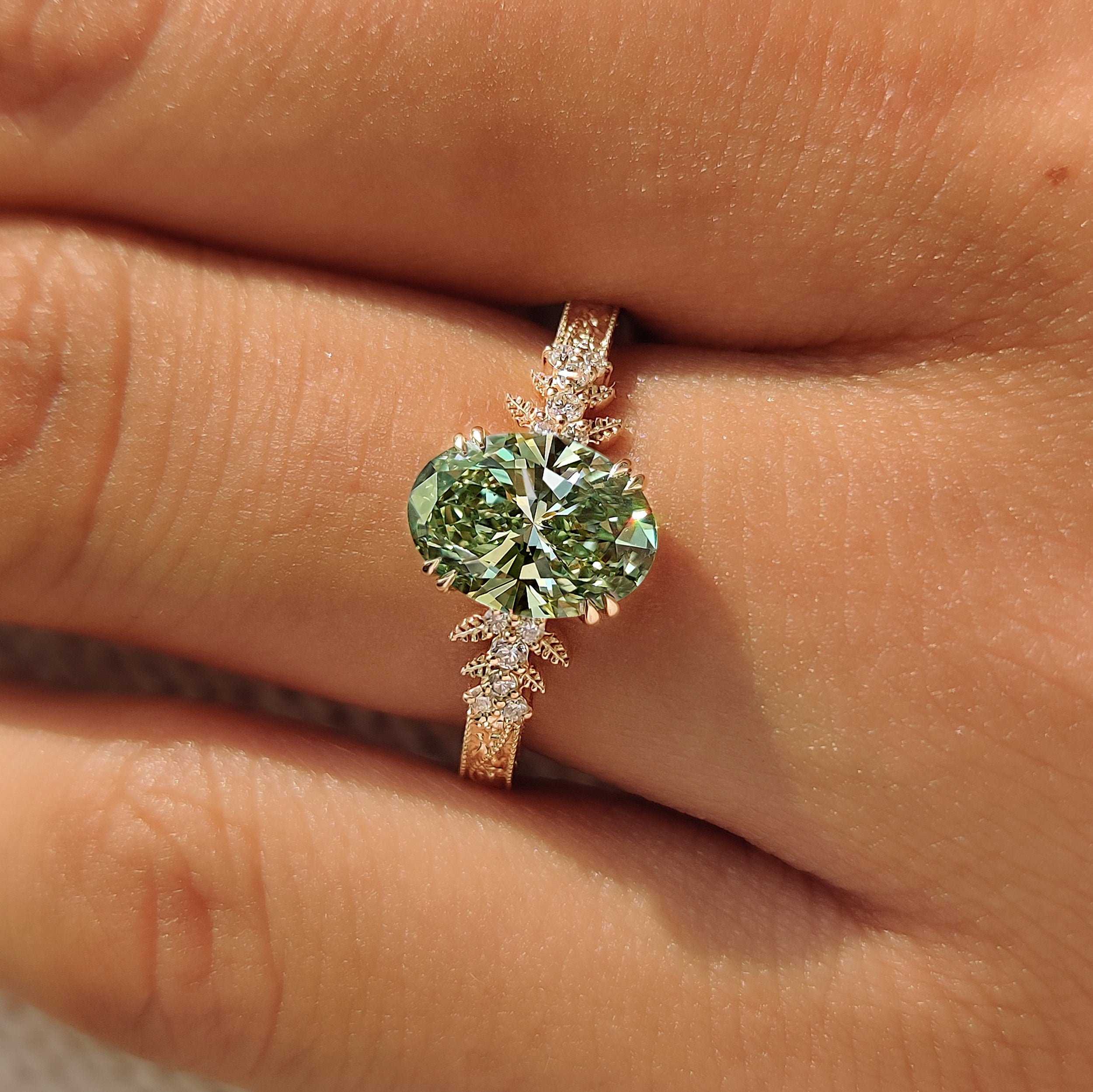 Nature inspired green oval diamond engagement ring.
