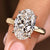 Hidden halo engagement ring with oval cut diamond

