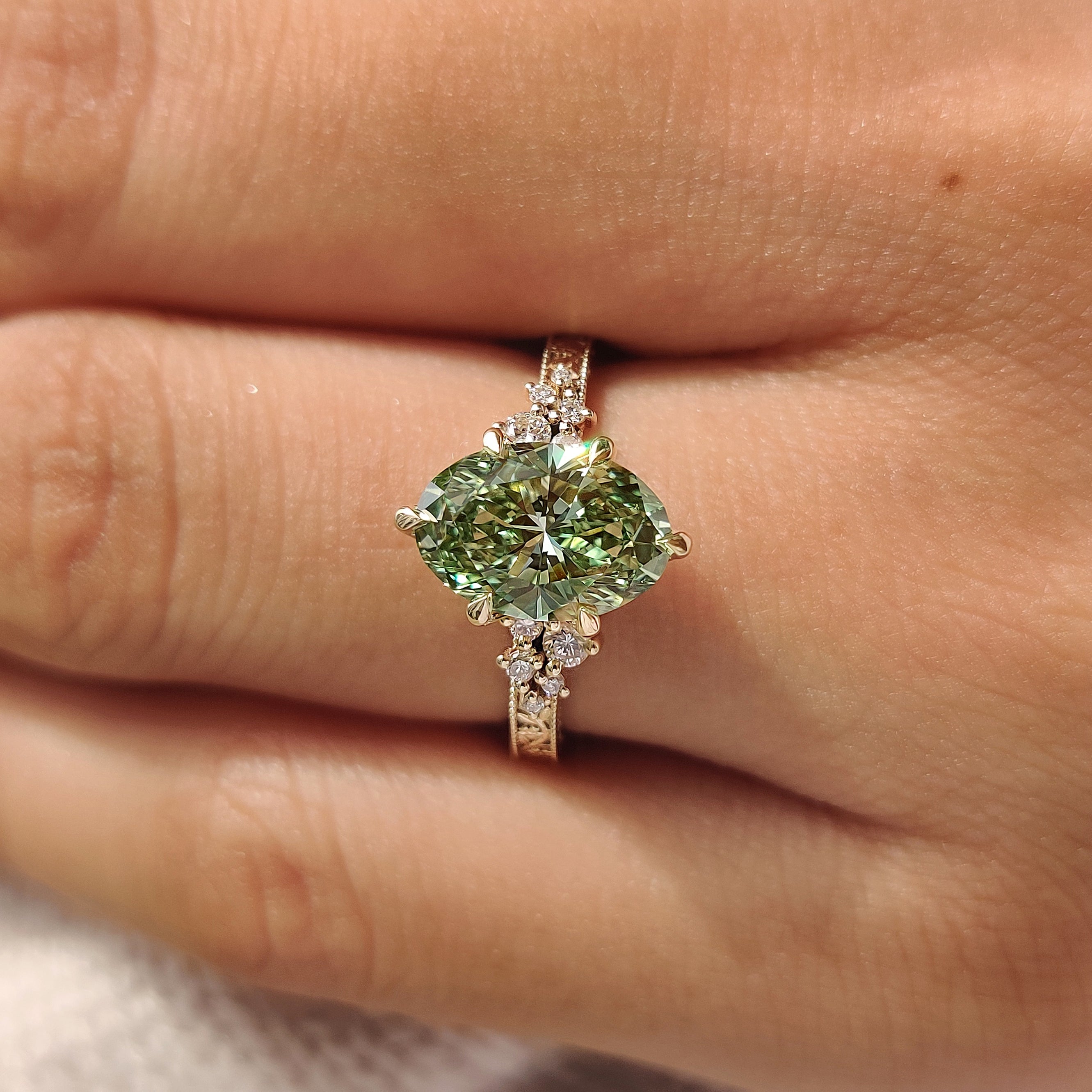 Vintage inspired green oval engagement ring
