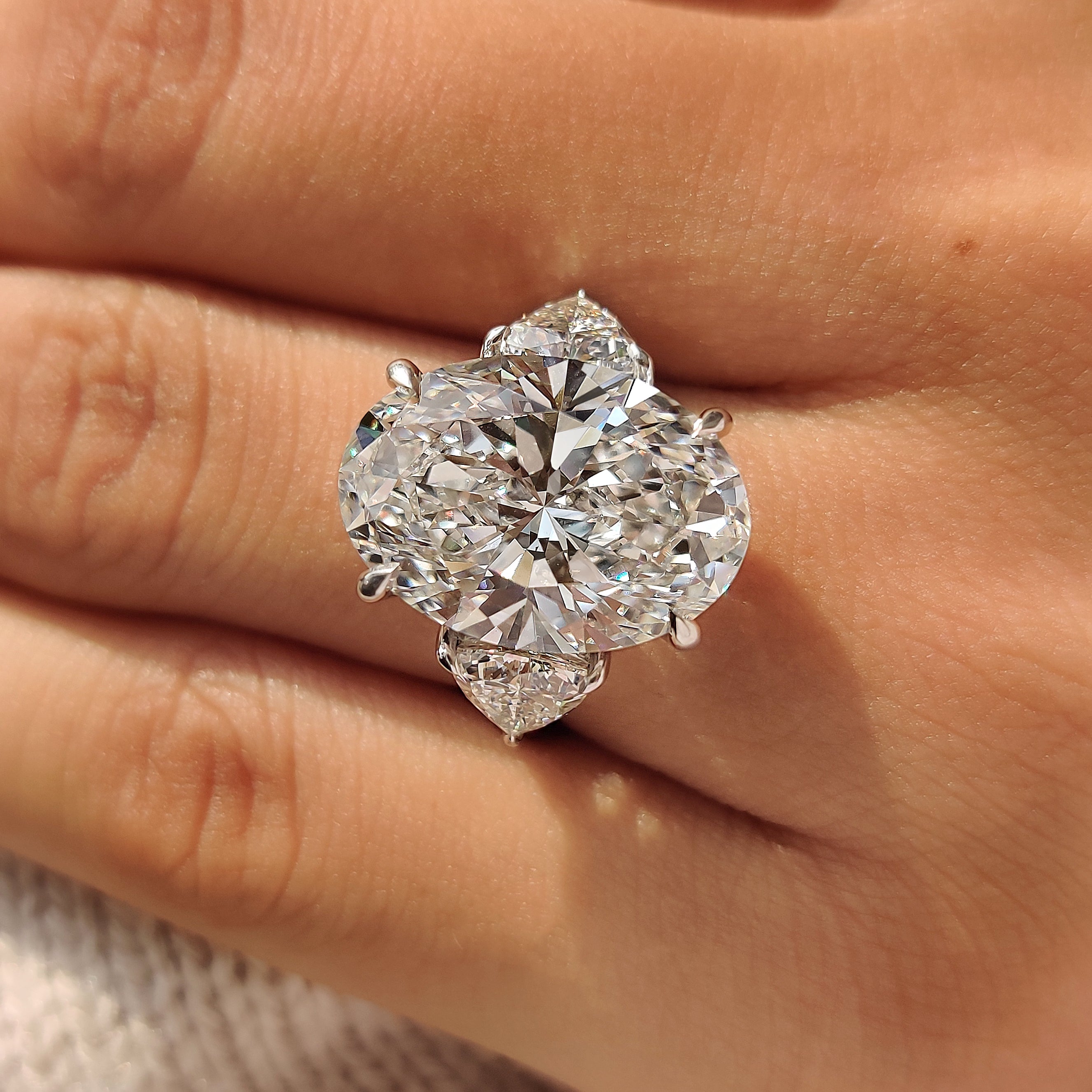 Handmade oval diamond ring with six claw prong
