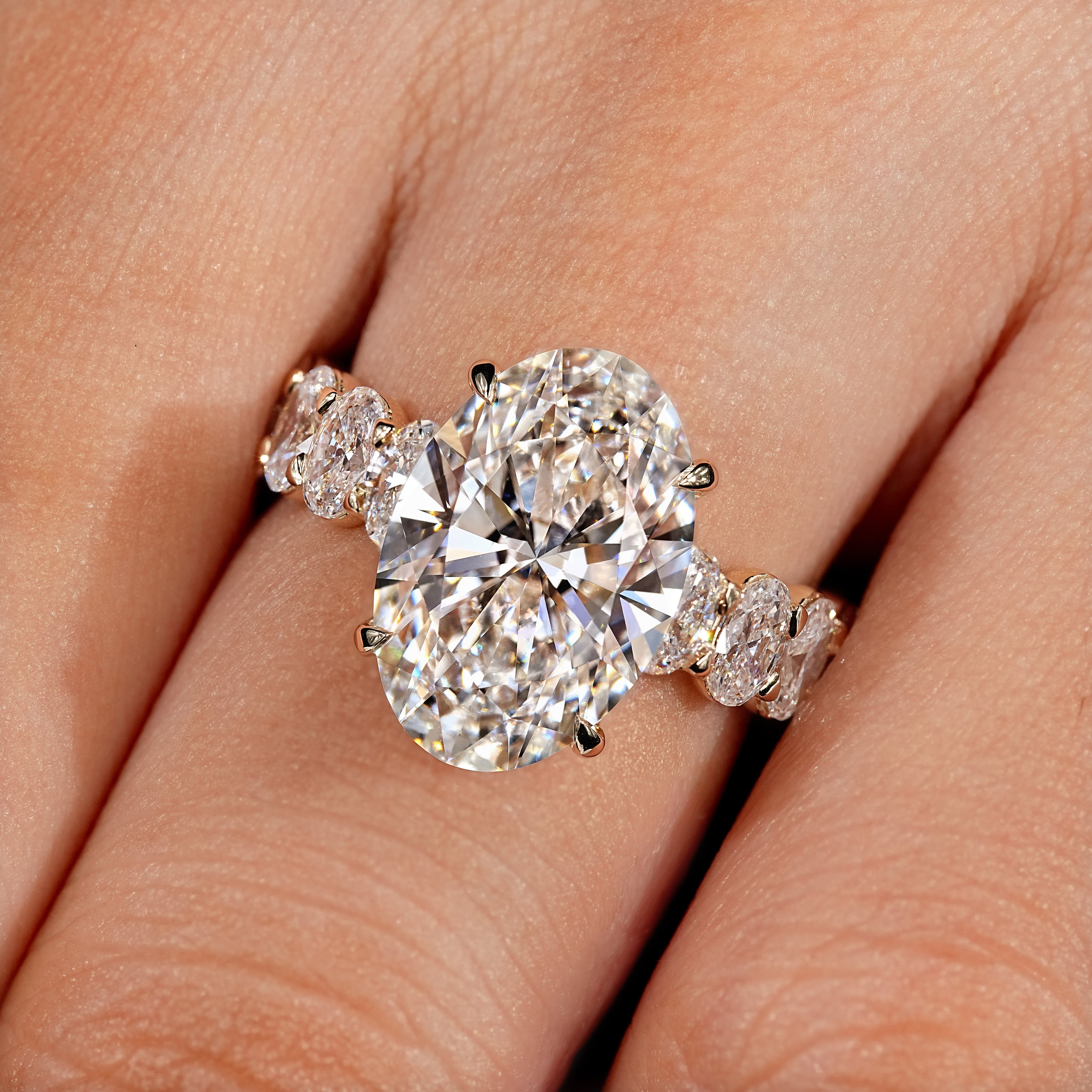 Oval engagement ring with four claw prong setting
