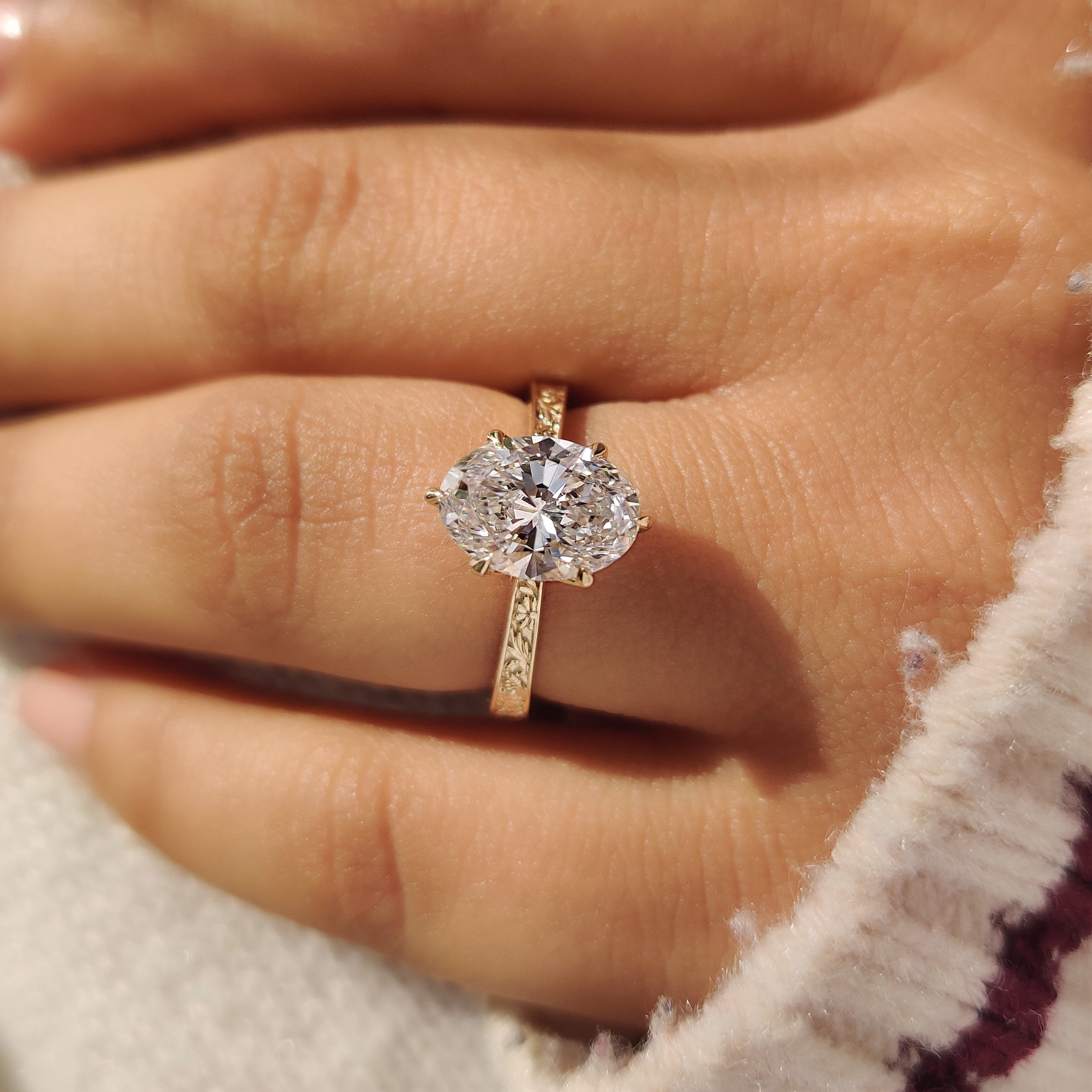 Vintage style oval diamond ring with tulip setting design
