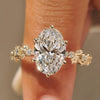 Sakura flower ring with oval center diamond.

