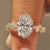 Sakura flower ring with oval center diamond.
