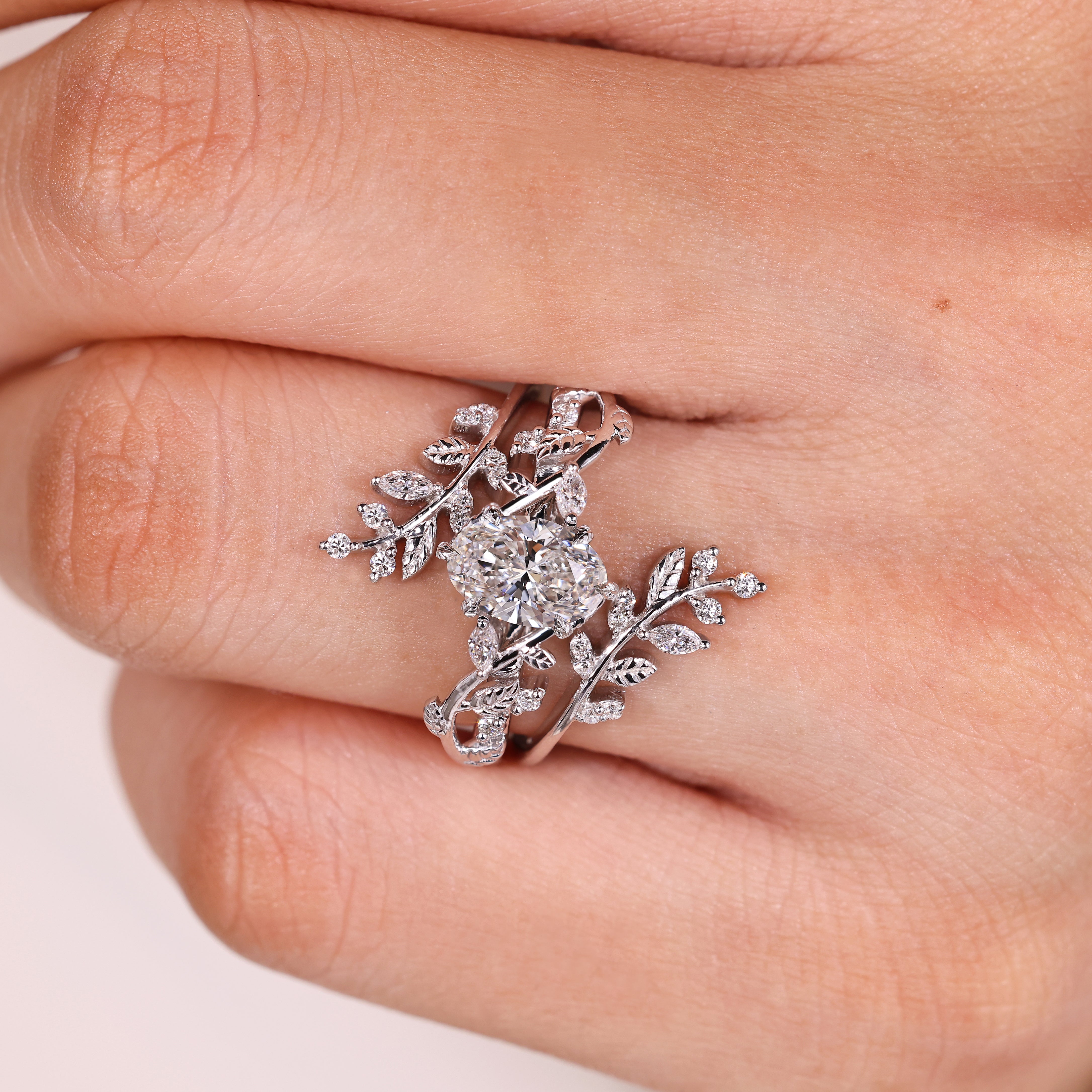 Oval Engagement Ring with Leaf Style Prong
