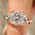 Oval cut engagement ring with twisted shank and hidden halo
