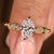 Oval cut lab grown diamond ring with round side stones

