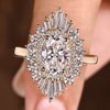 Oval cut engagement ring with snowflake halo design details
