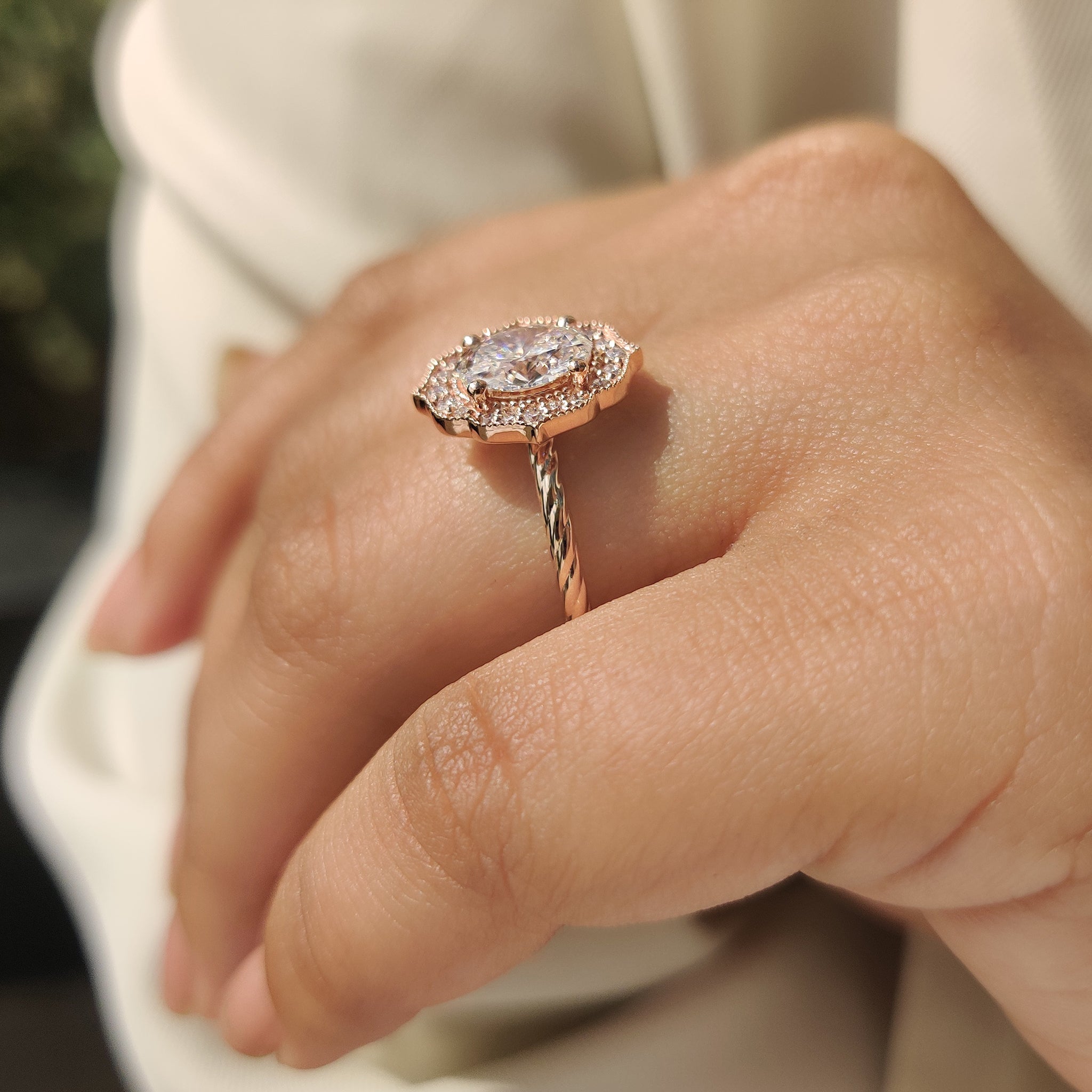 Handmade oval diamond engagement ring with twisted shank band.

