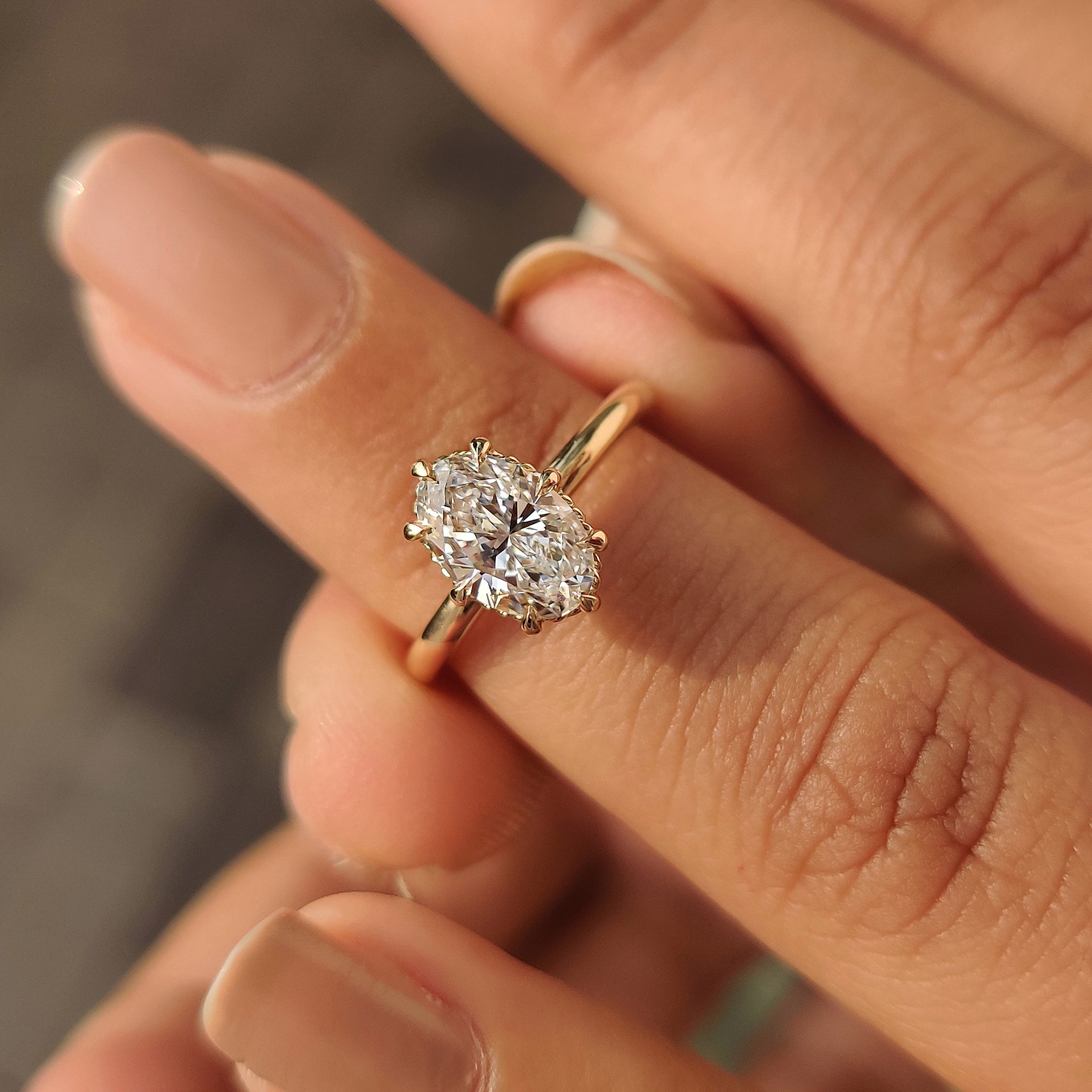 Oval engagement ring solitaire design with secure eight claw prong
