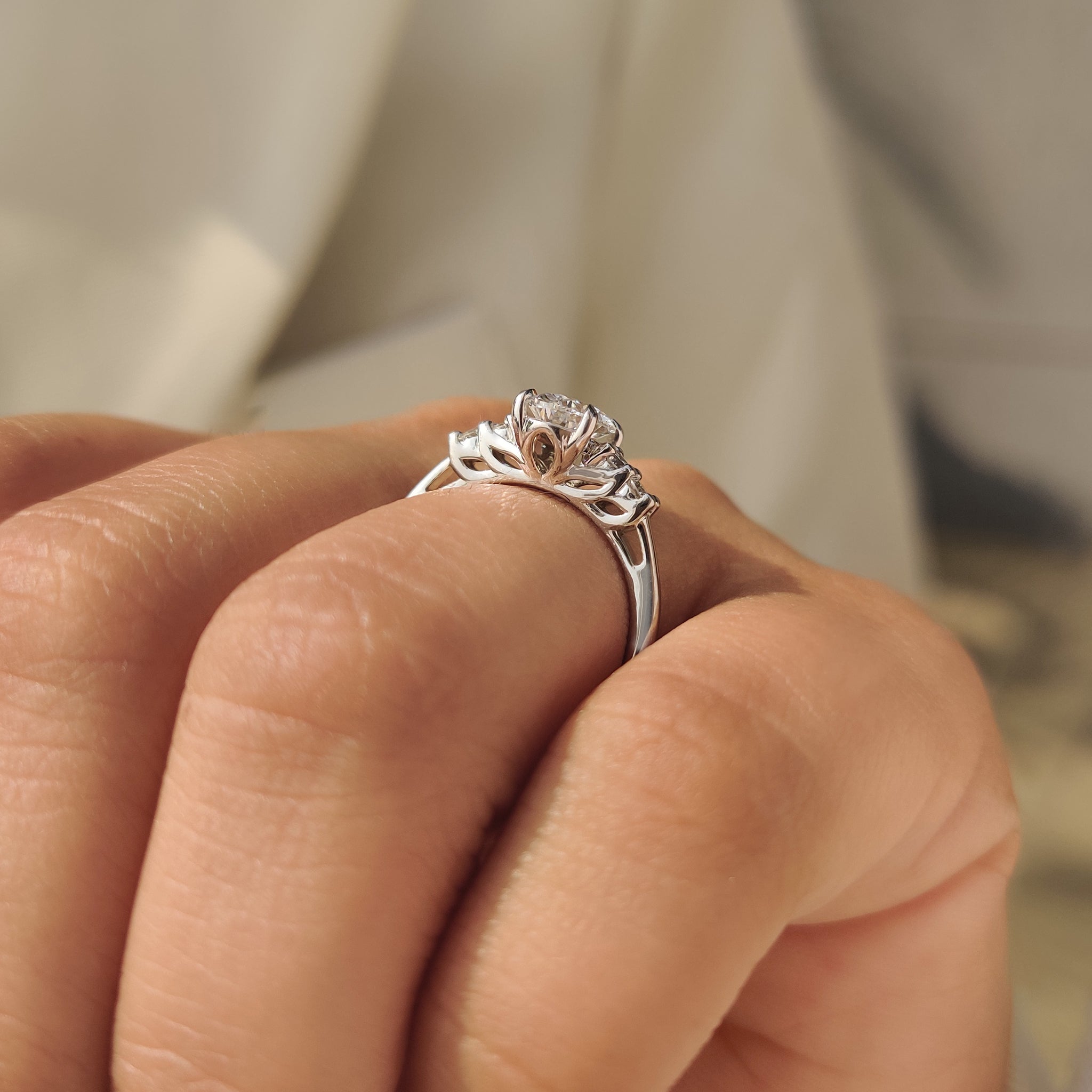Oval cut diamond ring with four claw prong setting.

