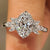 Oval cut diamond ring with marquise side stones design
