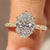 Oval diamond ring with pink ruby hidden accent details
