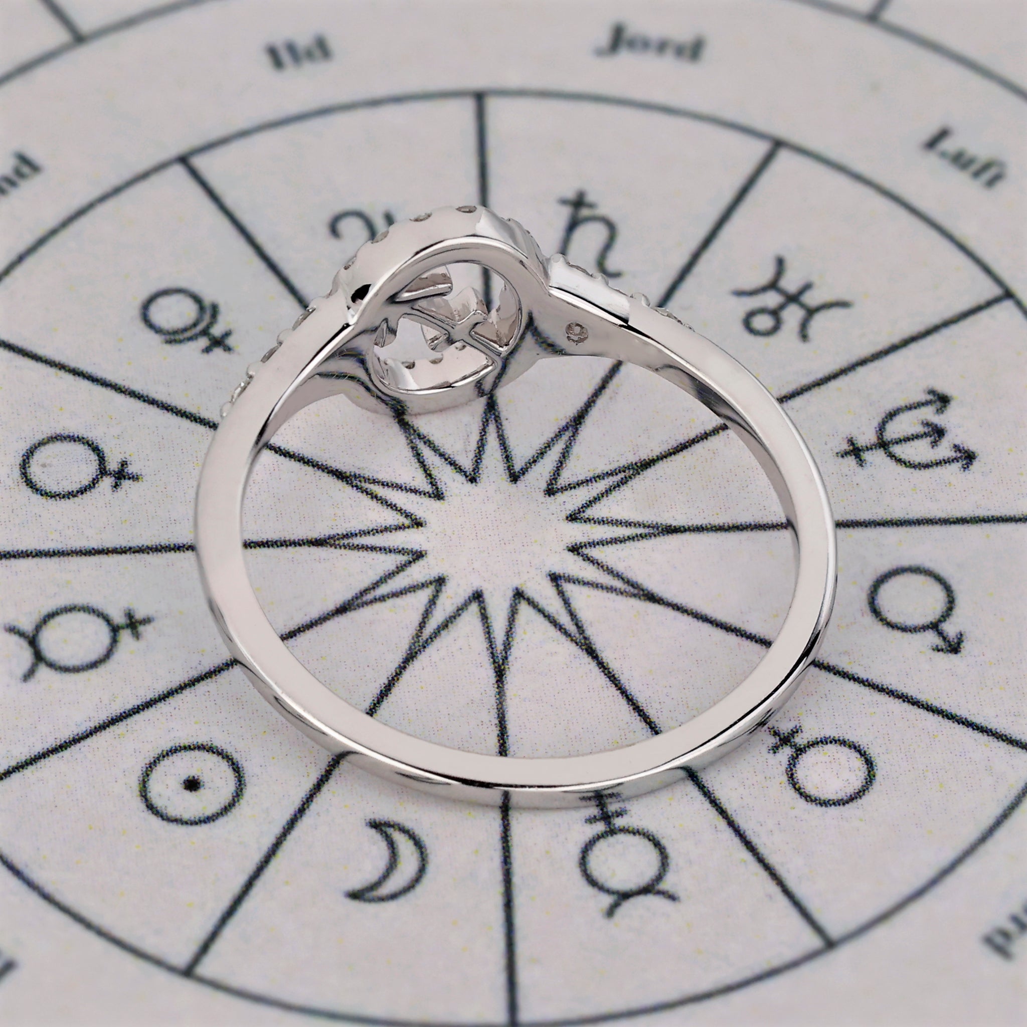 Buy engagement ring with Sagittarius zodiac design and halo diamond setting.
