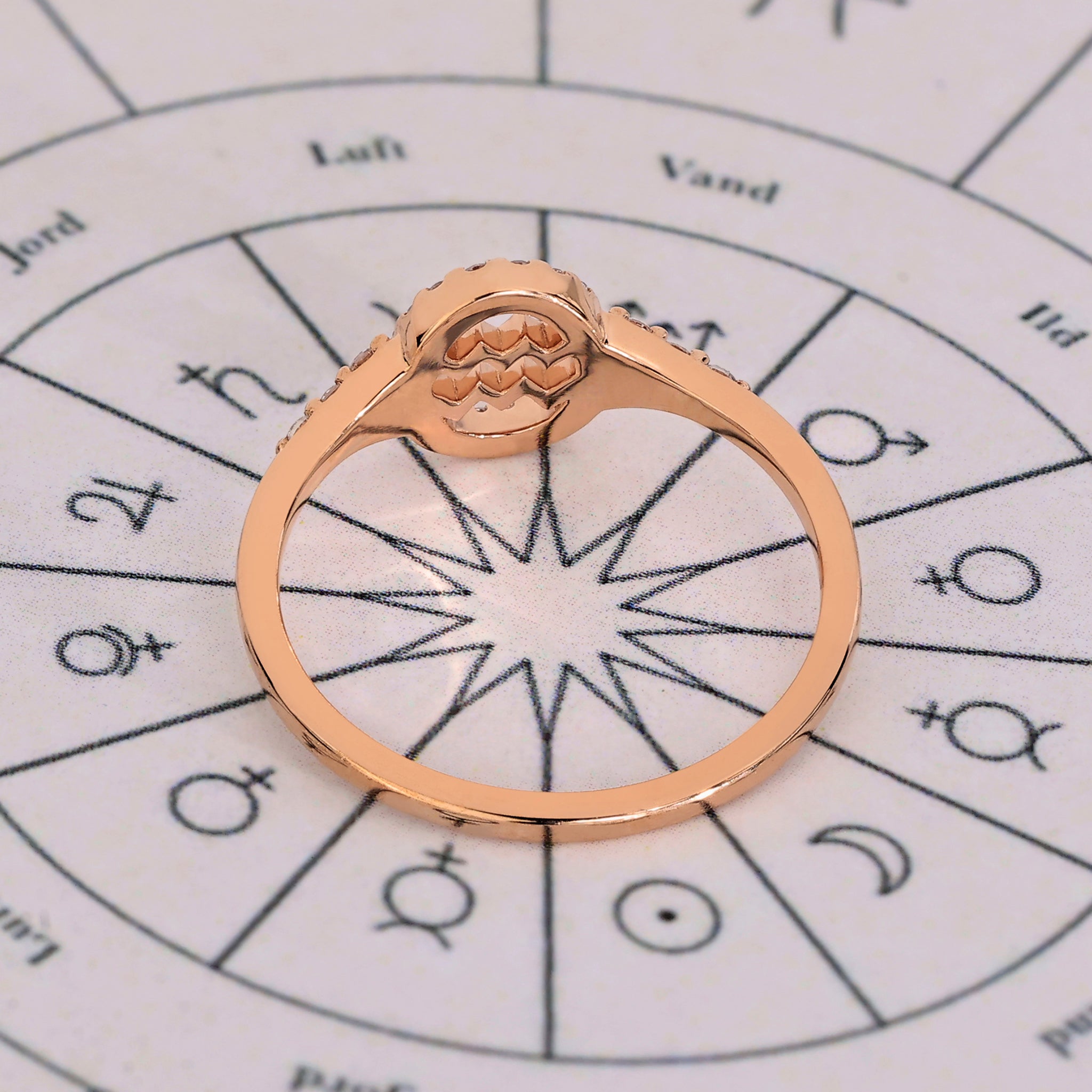 Carat Diamonds Aquarius ring with handmade jewelry detailing and halo diamond.
