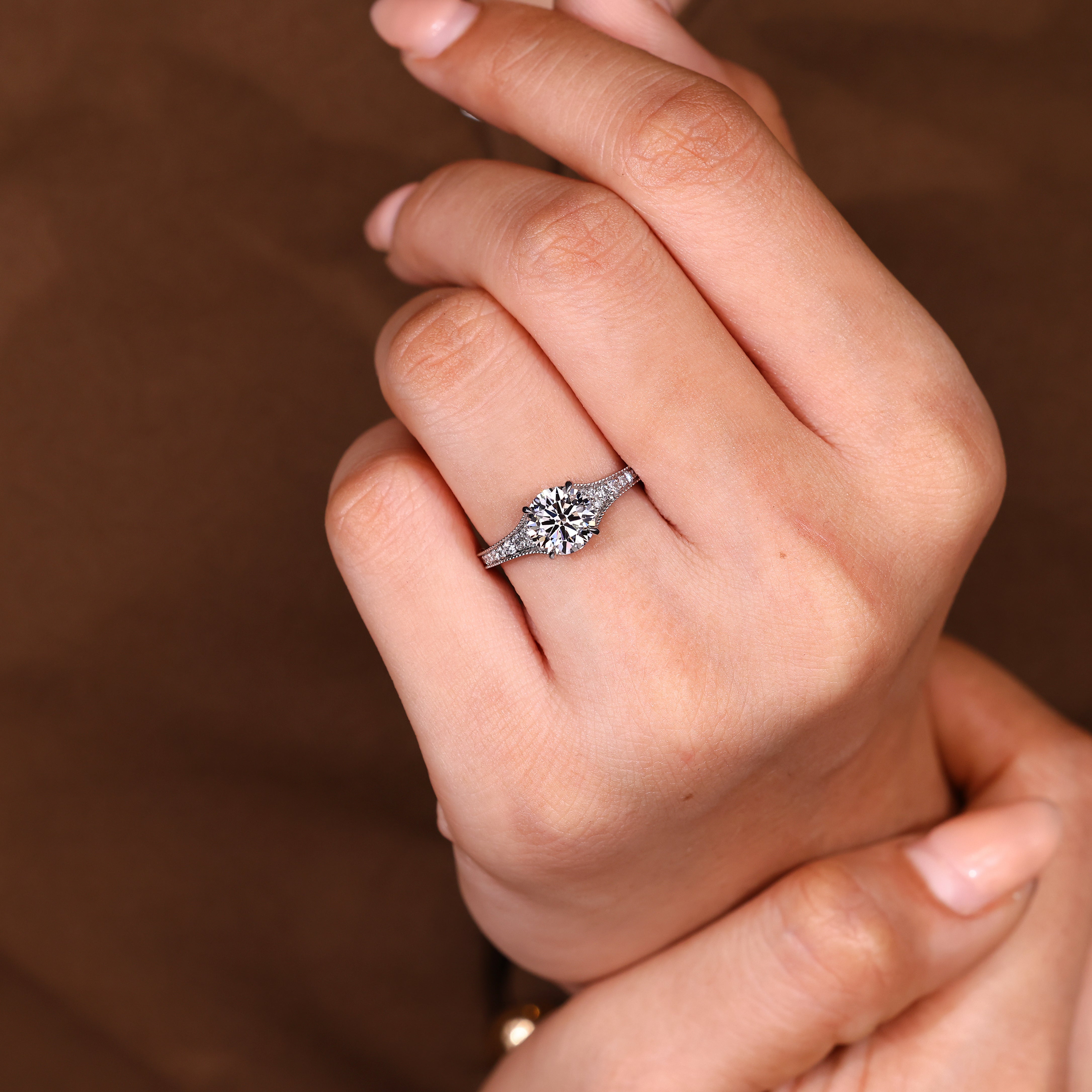 Round diamond ring with milgrain detailing

