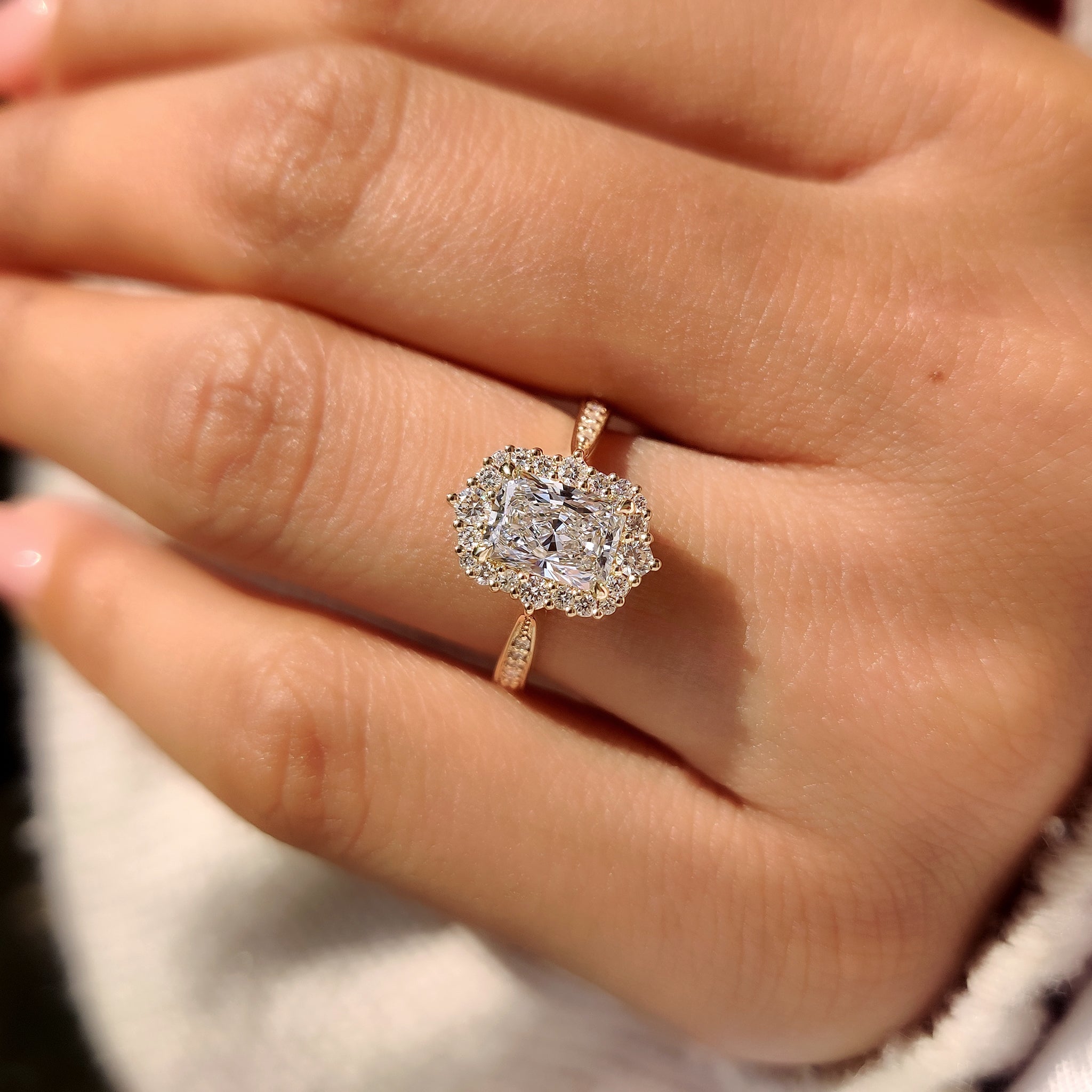 Handmade radiant cut ring with round halo setting.
