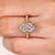 Dutch marquise center diamond in hidden halo setting
