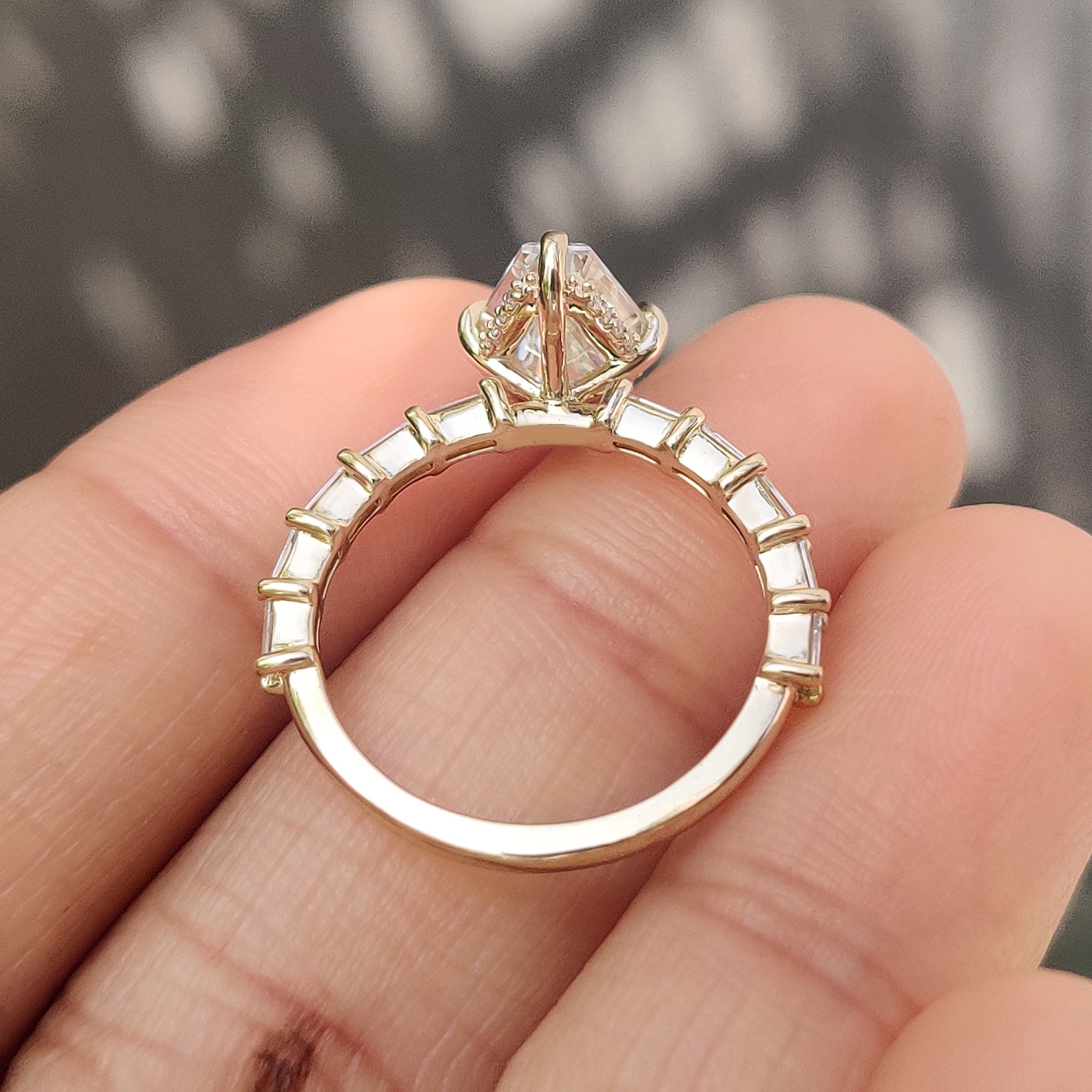Lab grown elongated hexagon ring with compass claw prong.
