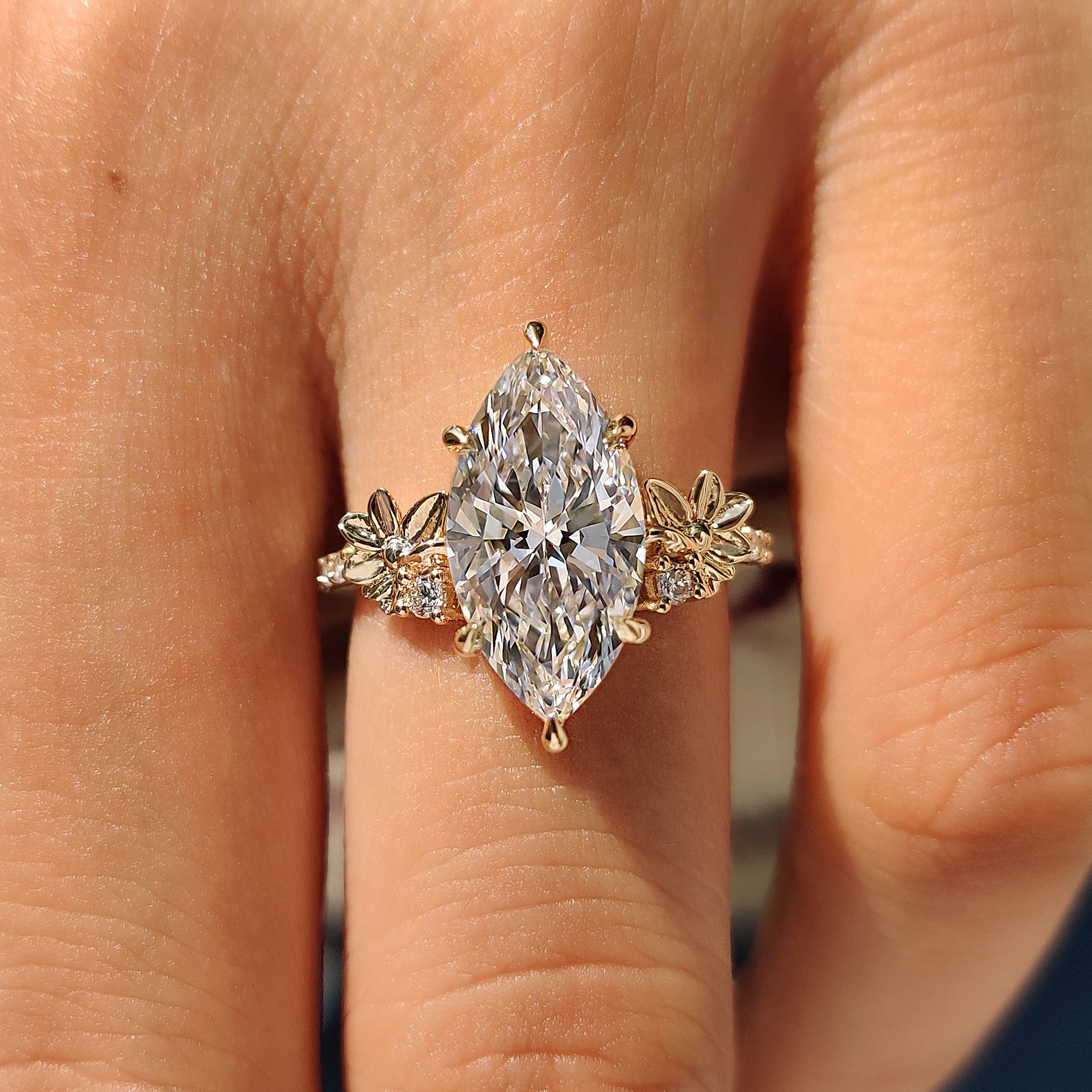 Vintage style marquise diamond ring with six claw prongs
