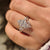 Marquise diamond ring with kite side stones and pave.
