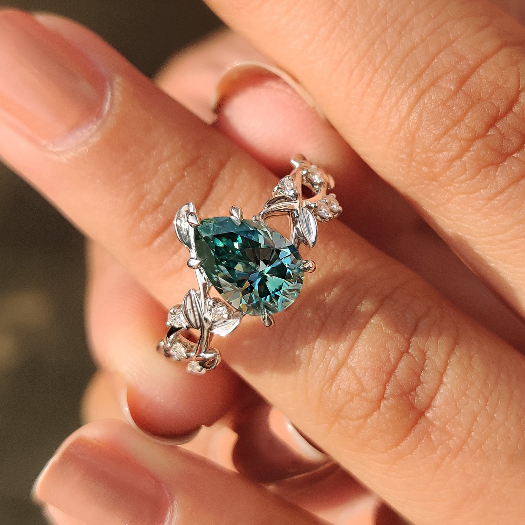 Handmade nature inspired ring with cyan blue moissanite pear
