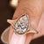 Pear cut diamond ring with solitaire bezel setting design.
