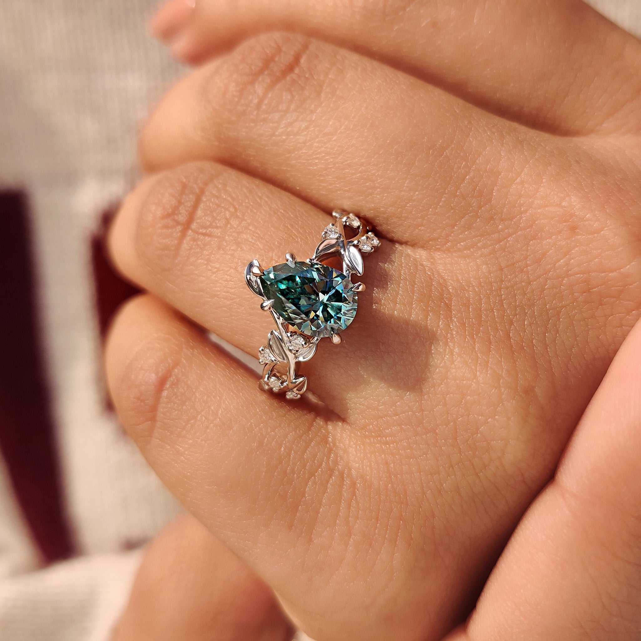 Cyan blue moissanite pear ring five claw prong setting
