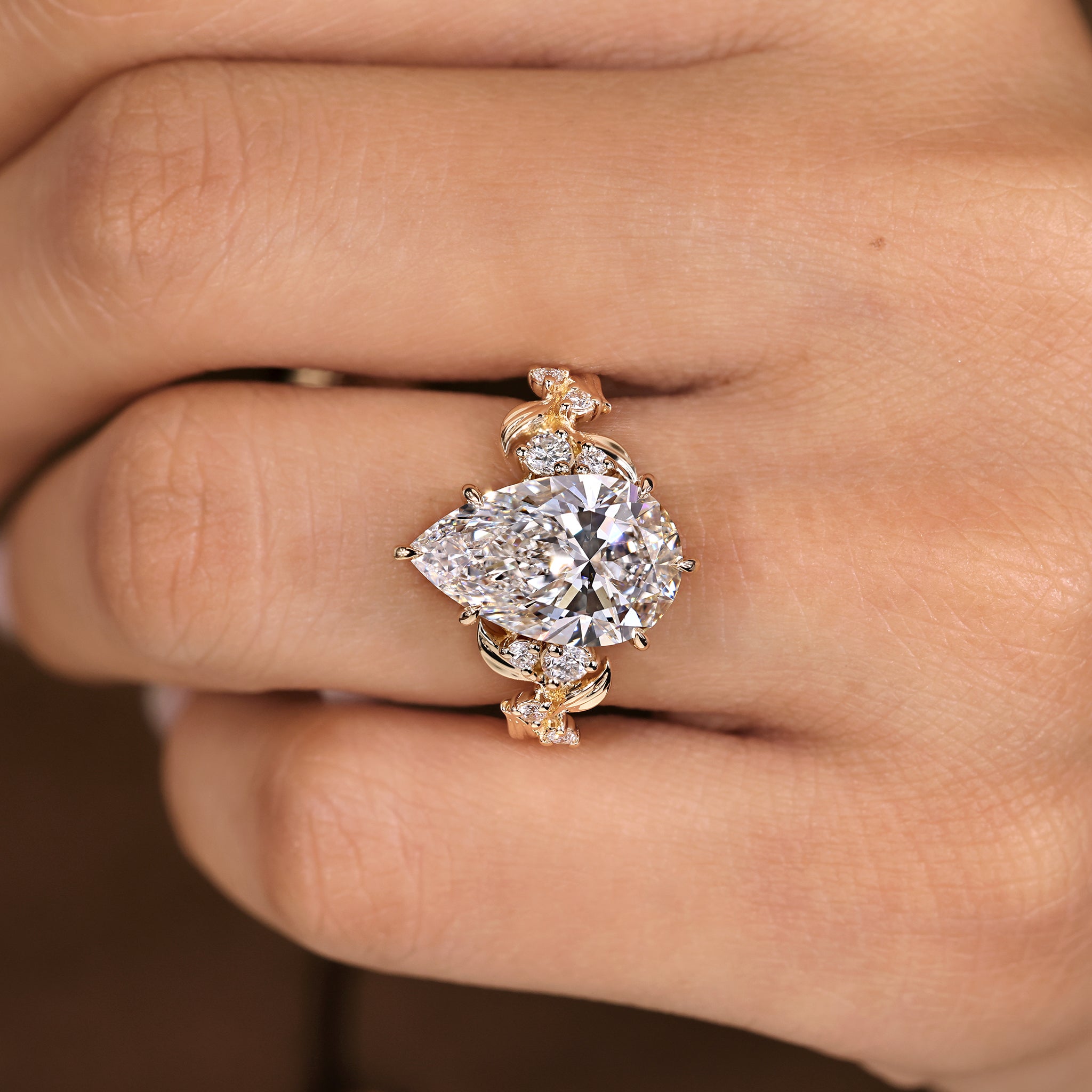 Pear shaped diamond ring crafted by hand with six claw prong
