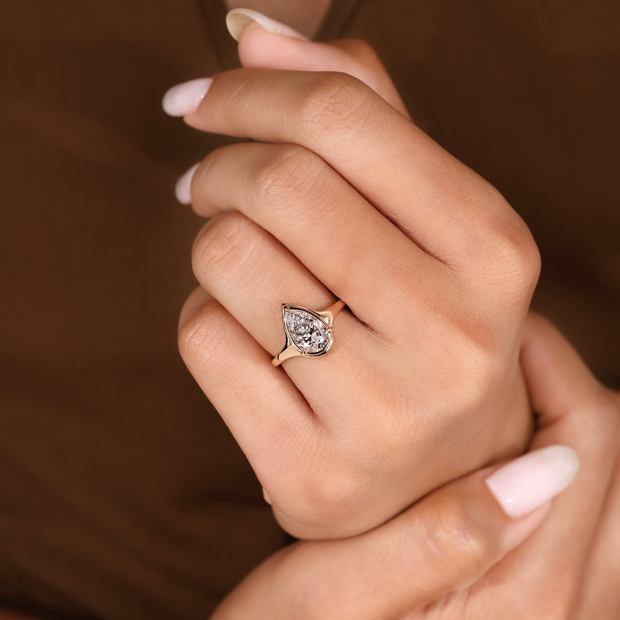 Three claw prong pear cut diamond ring handmade design.
