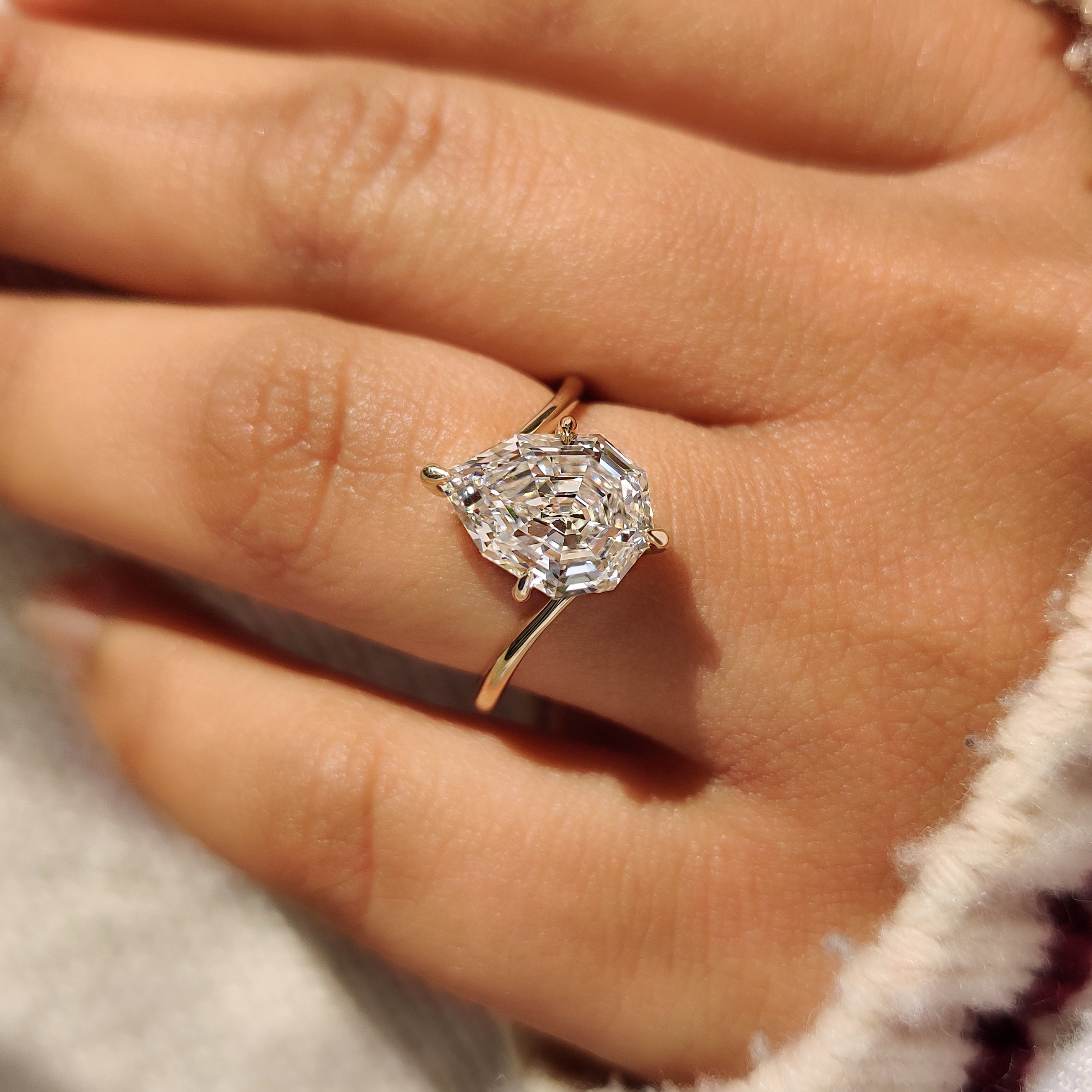 Pear diamond solitaire ring with four prong setting.
