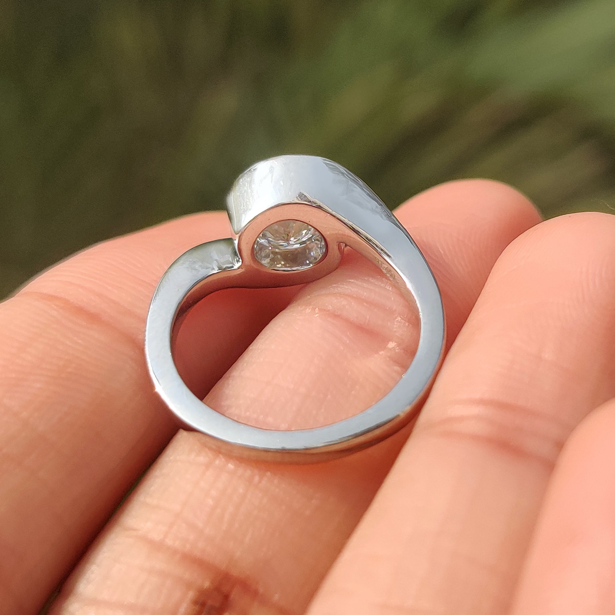 Portuguese cut diamond ring with secure half bezel setting.

