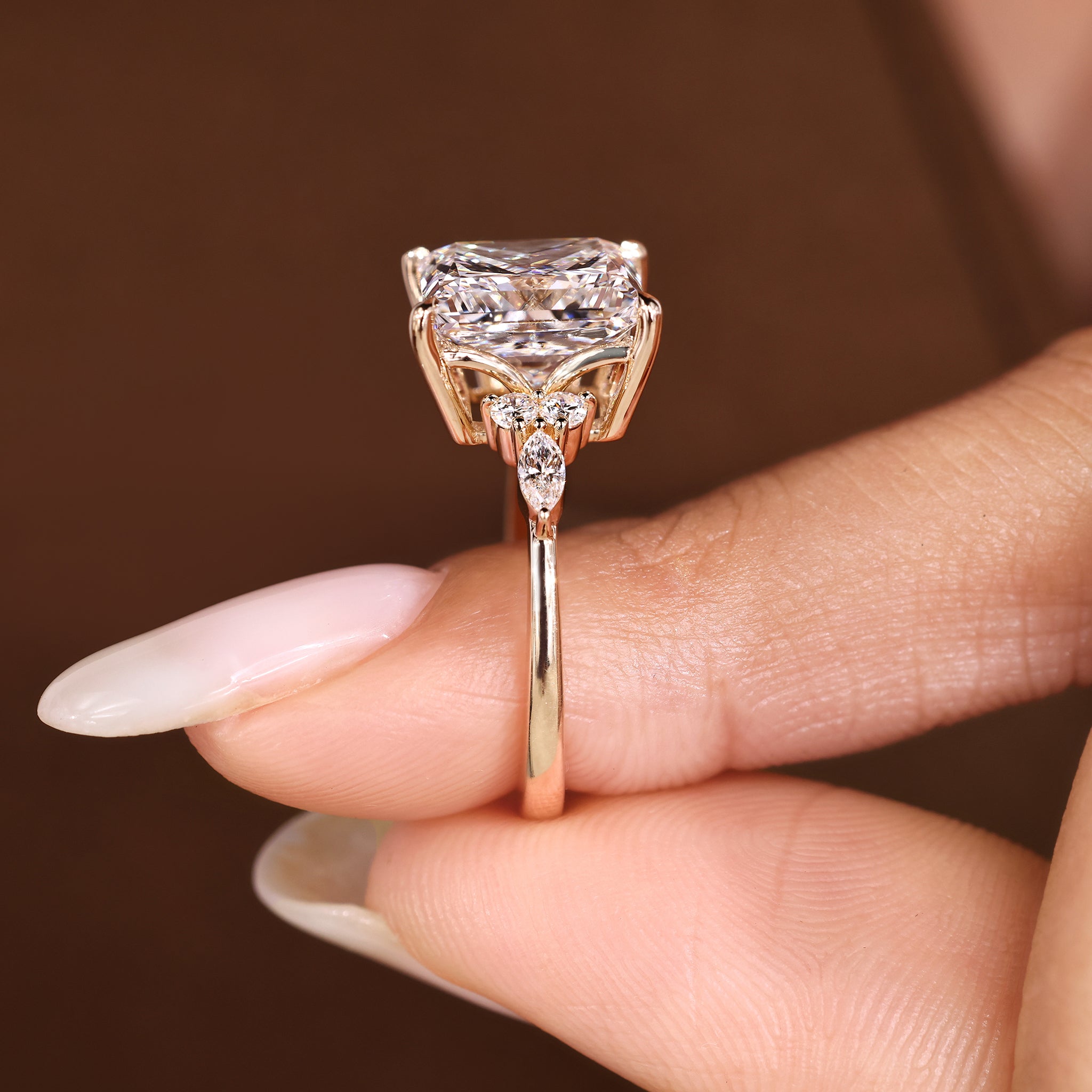 Seven stone princess cut diamond ring with tapered shank.
