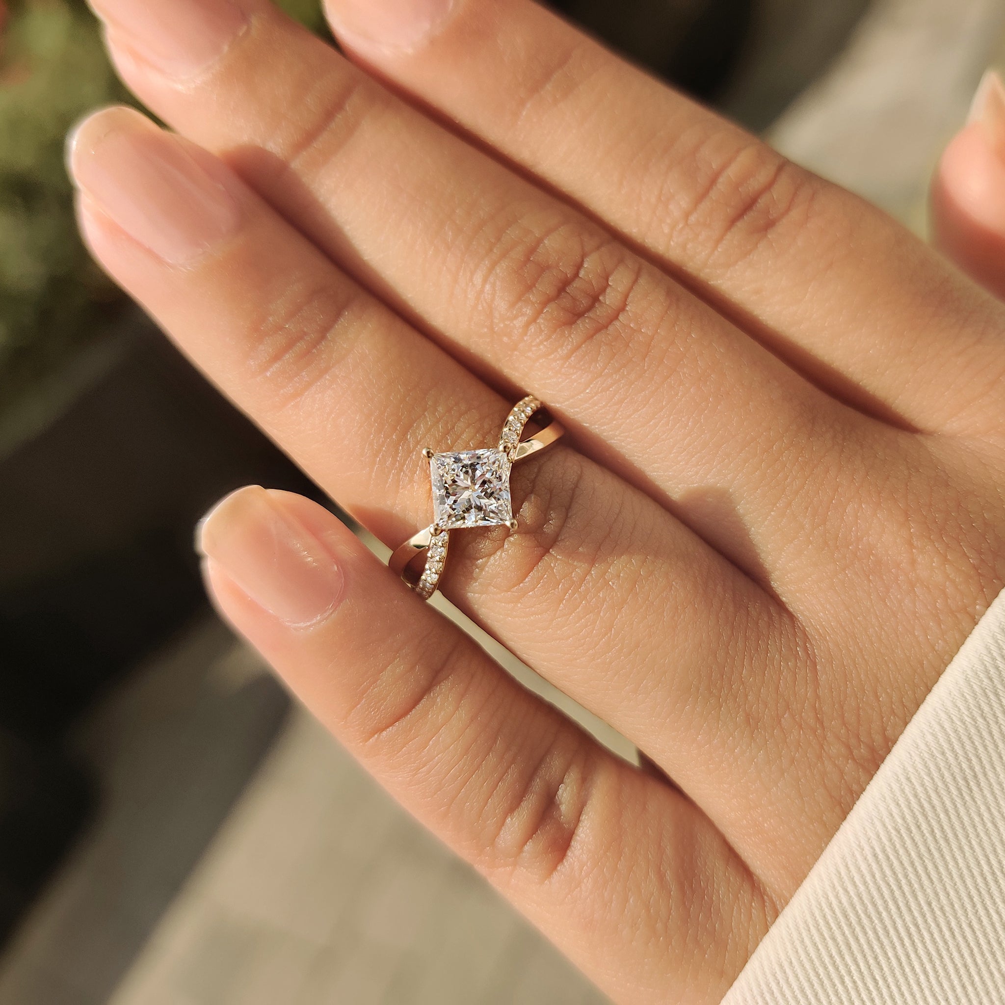 Princess cut diamond ring with secure compass prong detail
