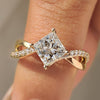 Princess cut diamond ring with round diamond twisted pave style
