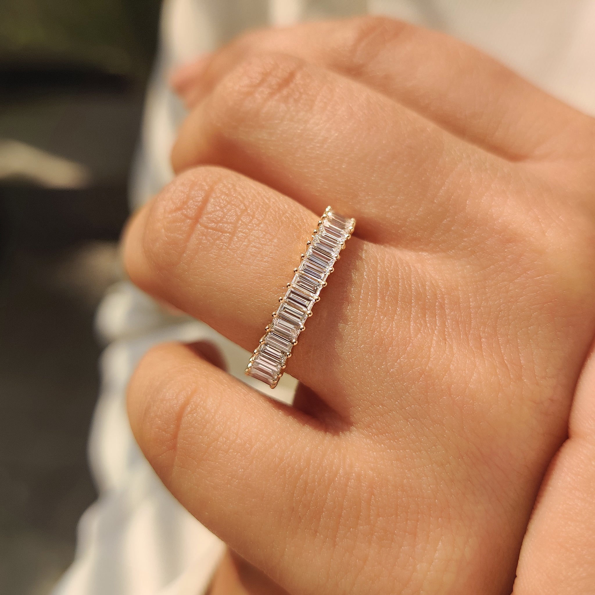 Baguette diamond band with prong setting and half eternity.

